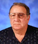 Buster Albertson coached ten All-Americans at Indian Hills CC